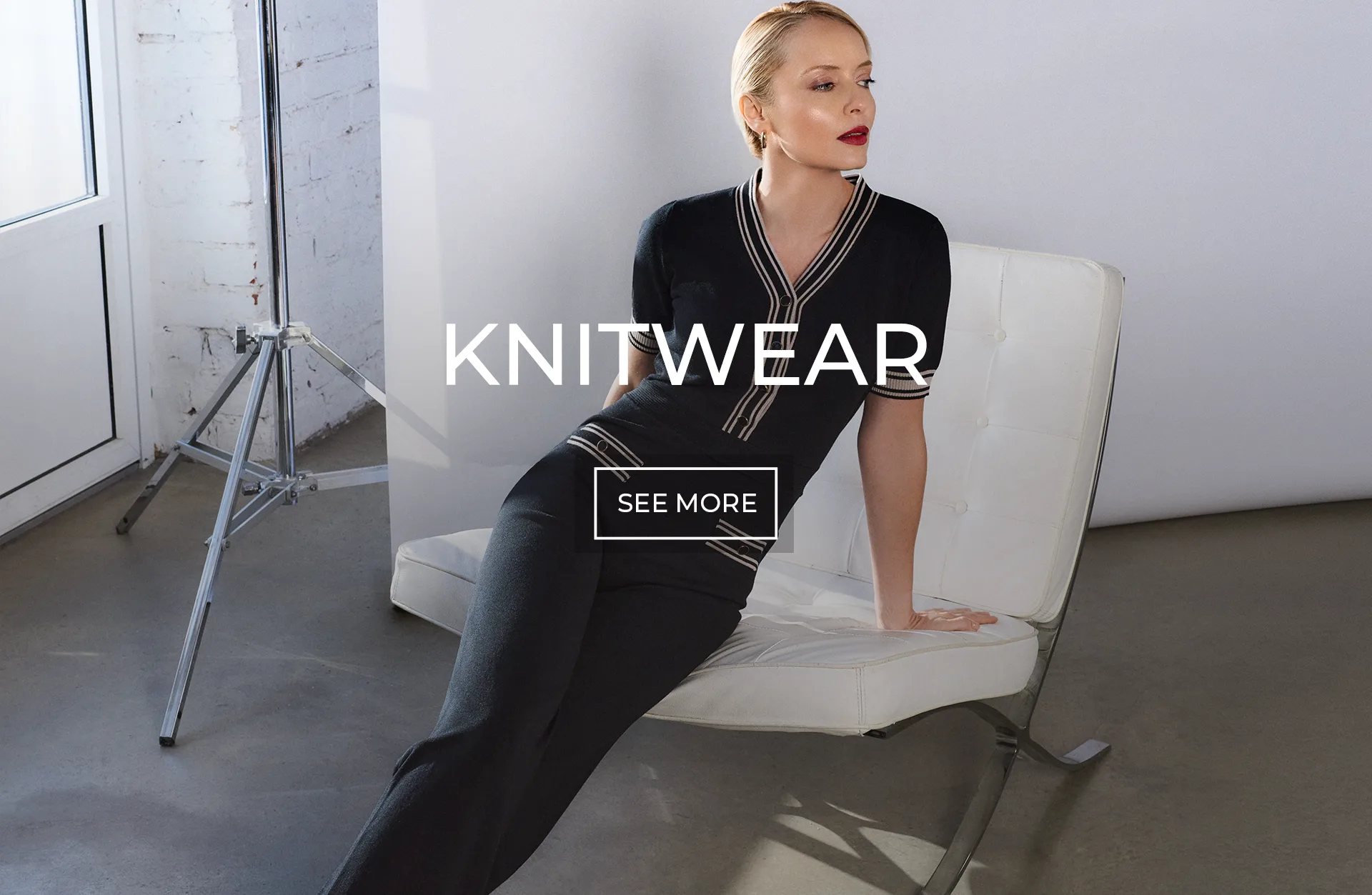 Women’s Knitwear | DiKa Model wearing a black knitted jumpsuit with contrast trim by DiKa