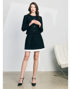 Black short cotton tweed skirt with white pleat detail at the hem | Skirts - 1