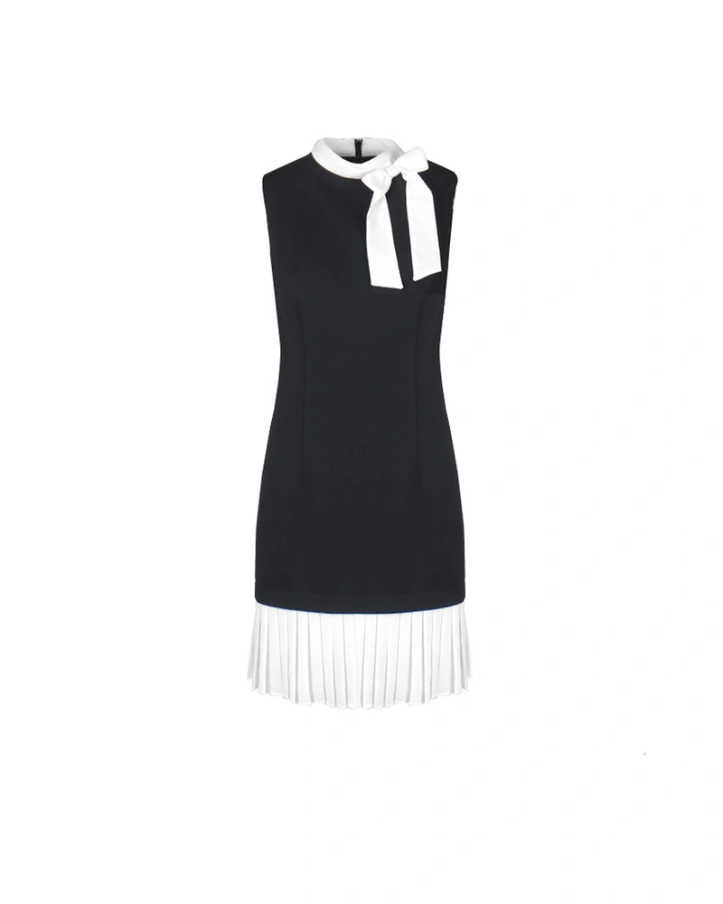 Black dress with a white contrast bow and pleated white bottom | Party Collection