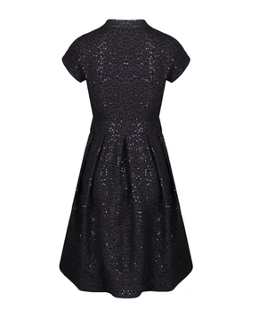 A dress made from textured fabric |  - 1
