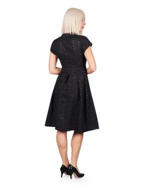 A dress made from textured fabric |  - 4
