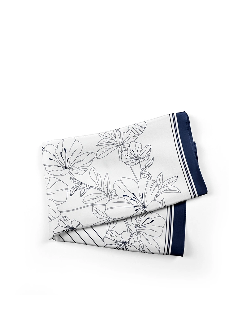 Scarf with stylized floral-geometric elements in white and black | All accessories